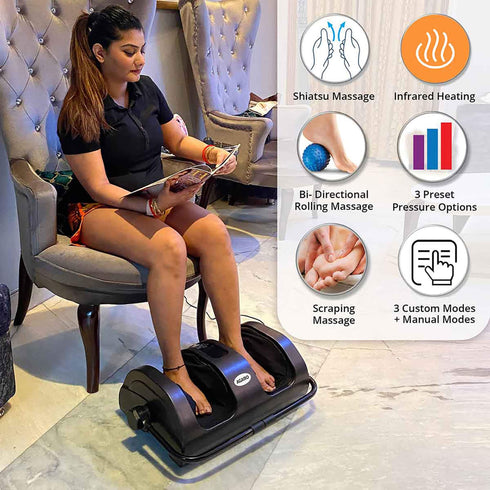 Women sitting on grey chair and using Shiatsu Foot Massager