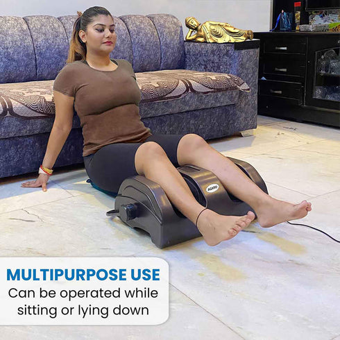 Women sitting on floor and using Shiatsu Foot Massager