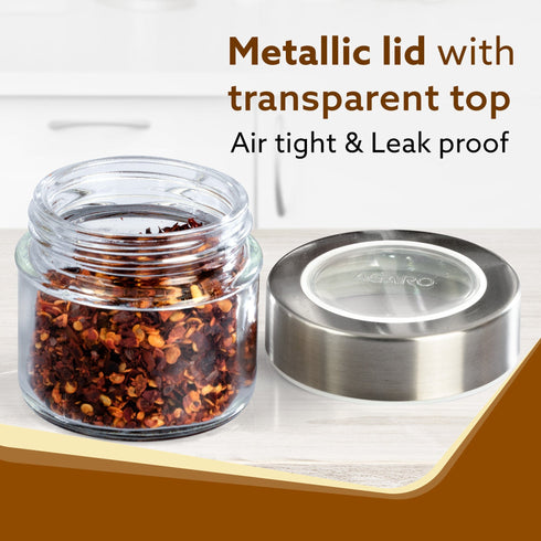 Elegant Glass Spice Jar with Metal Stand, Pack of 4, 100Ml Each, Transparent Body, Steel lid with transparent plastic, Stores Spices